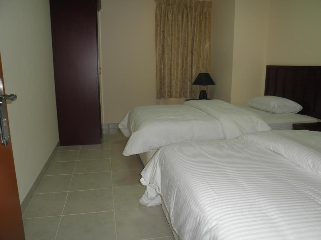 Hamasa Plaza Hotel y apartamentos Al Buraimi Habitación foto